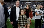 (L-R) Kyle Busch, son Brexton Busch, and wife Samantha Busch on the Las Vegas Raiders' sideline. Source: Getty